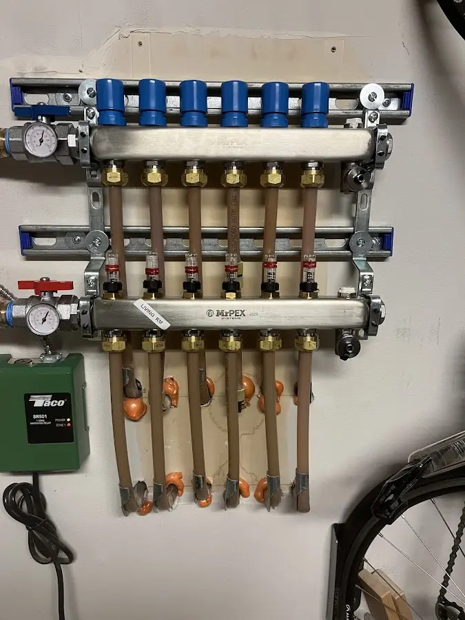 Plumber performing Water Heater Repair at a residential property in Medfield